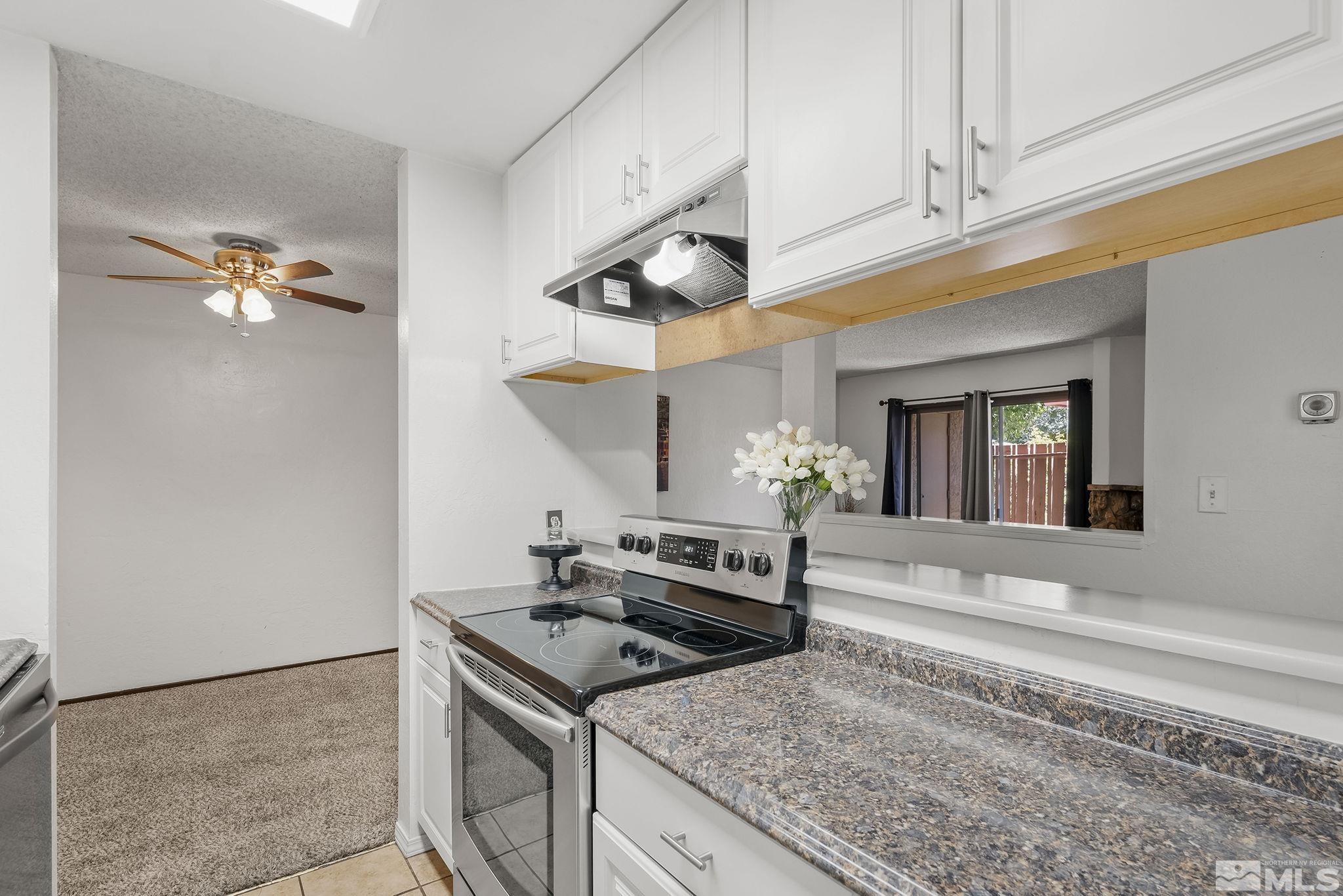1000 Beck Drive, Unit 170 Reno, NV 89509 - Photo 15 of 23 a kitchen with a stove and a cabinet