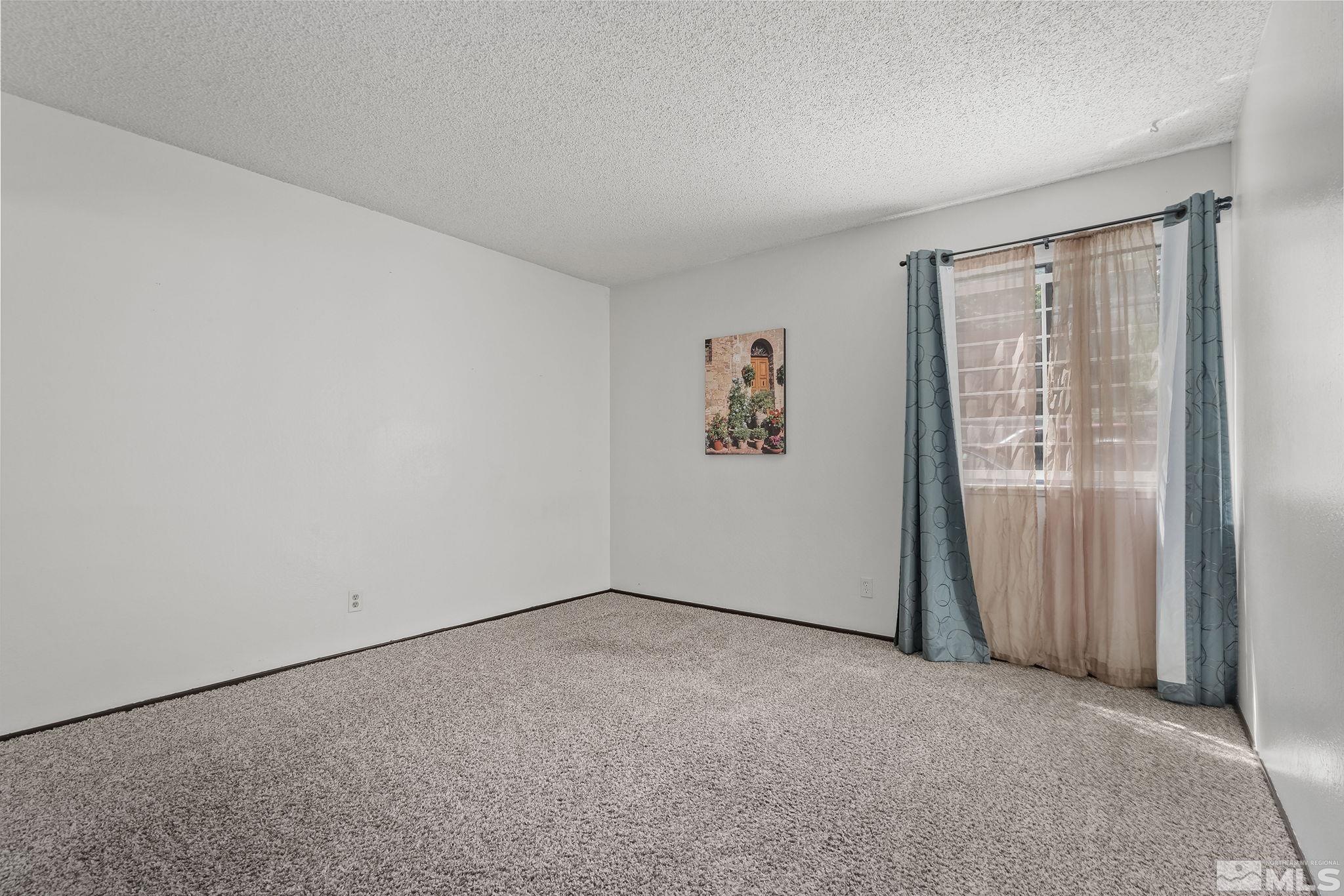 1000 Beck Drive, Unit 170 Reno, NV 89509 - Photo 16 of 23 an empty room with windows