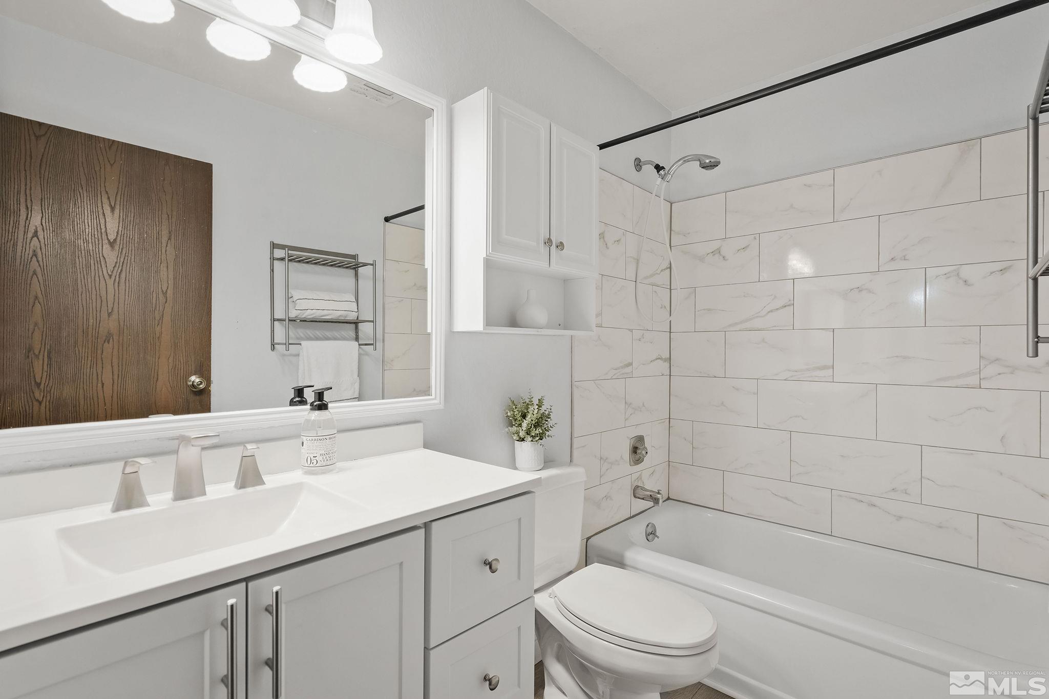 1000 Beck Drive, Unit 170 Reno, NV 89509 - Photo 21 of 23 a bathroom with a sink a toilet and shower