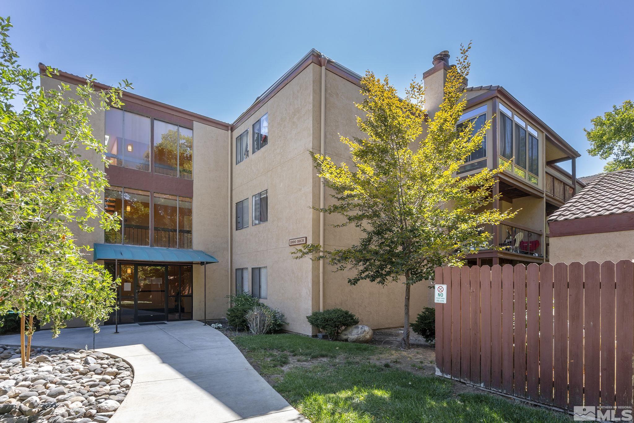 1000 Beck Drive, Unit 170 Reno, NV 89509 - Photo 3 of 23 a view of a house with a small yard and wooden fence