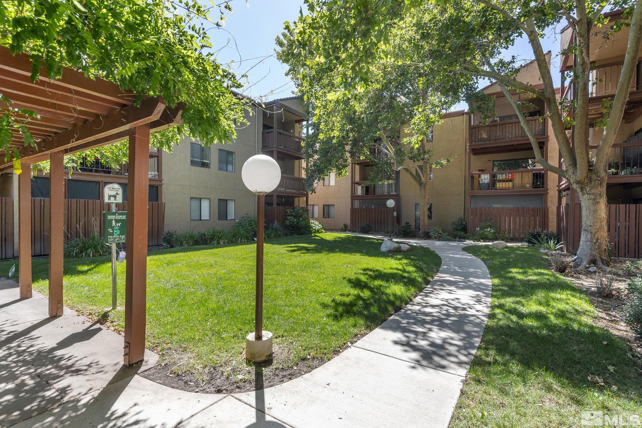 1000 Beck Drive, Unit 170 Reno, NV 89509 - Photo 4 of 23 a view of a house with backyard and a tree