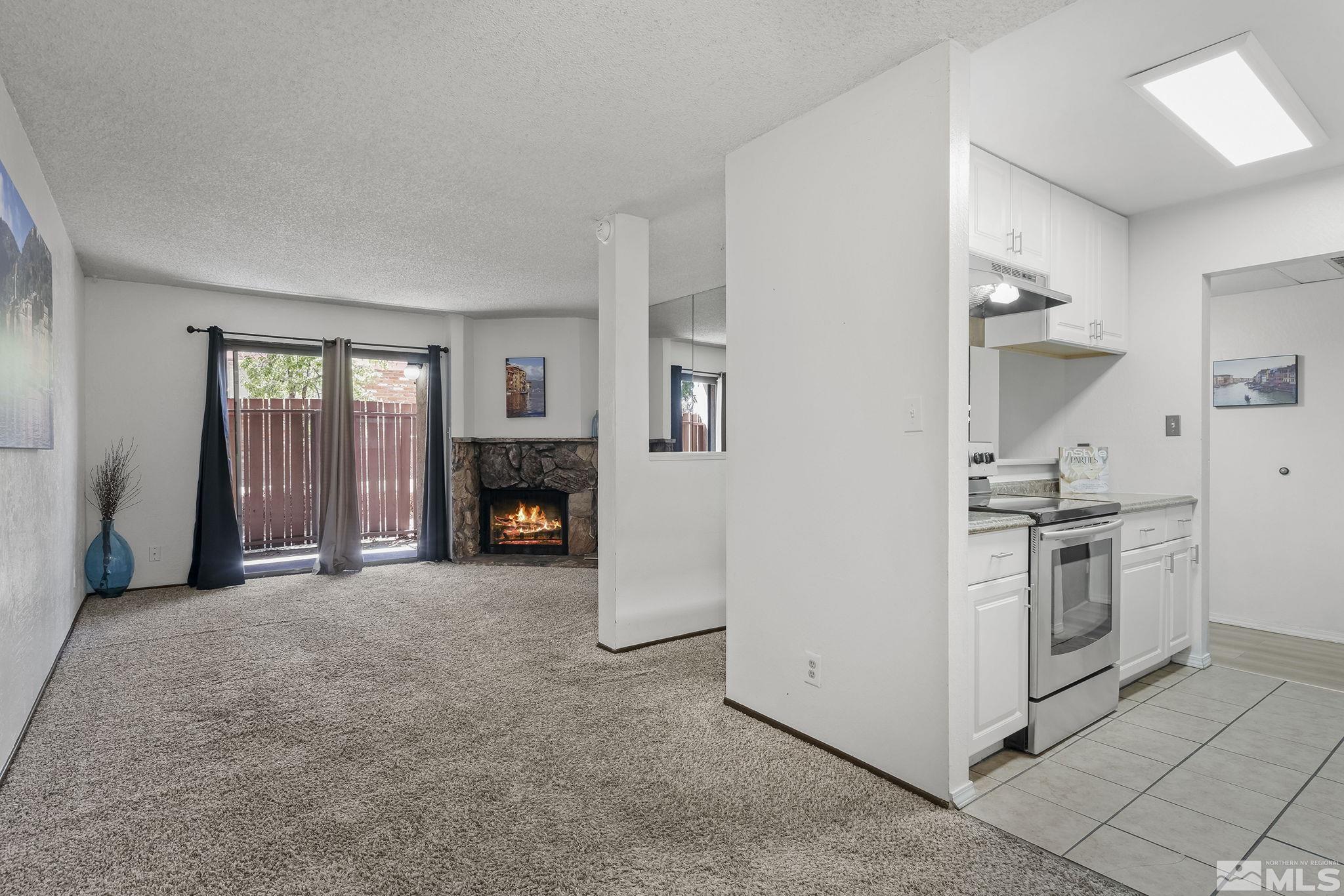 1000 Beck Drive, Unit 170 Reno, NV 89509 - Photo 10 of 23 a view of a kitchen with a stove cabinets and a refrigerator