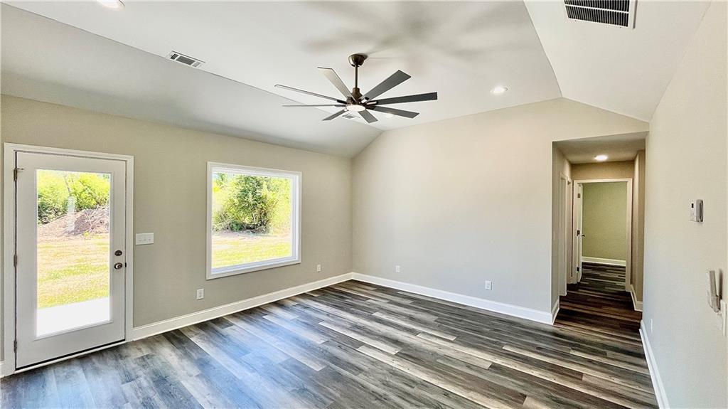 5 Green Road Griffin, GA 30224 - Photo 14 of 34 wooden floor in an empty room with a window