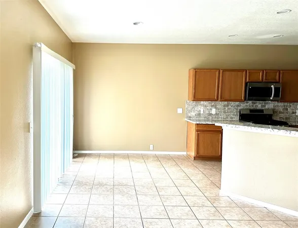a view of a kitchen with a sink and a stove top oven
