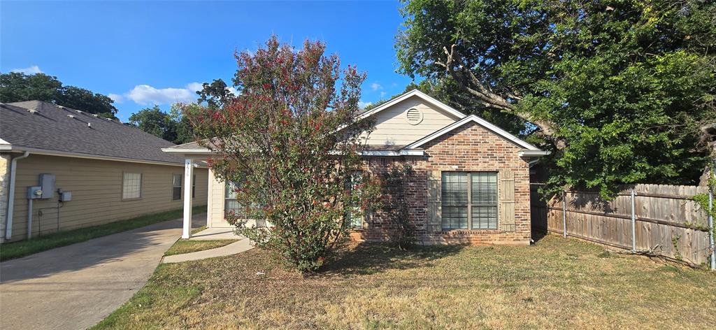 2616 South 2nd Street Waco, TX 76706 - Photo 1 of 29 Brick facade, horizontal siding, shuttered window, covered entry, and paved driveway