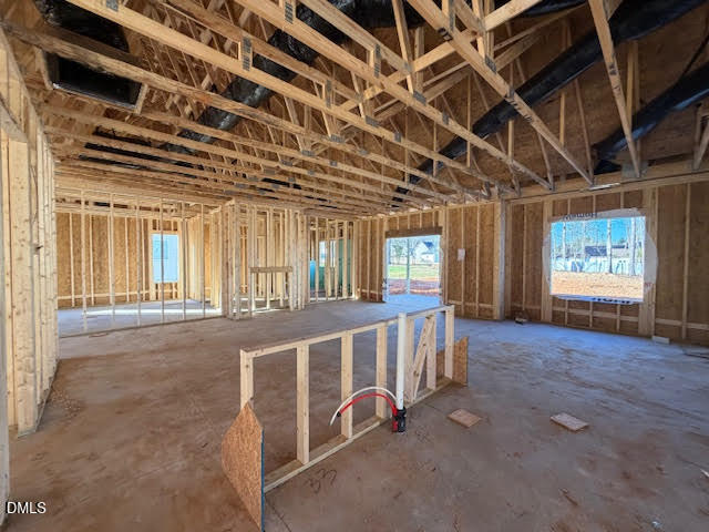 225 Seahawk Way Zebulon, NC 27597 - Photo 2 of 5 a view of an empty room with windows