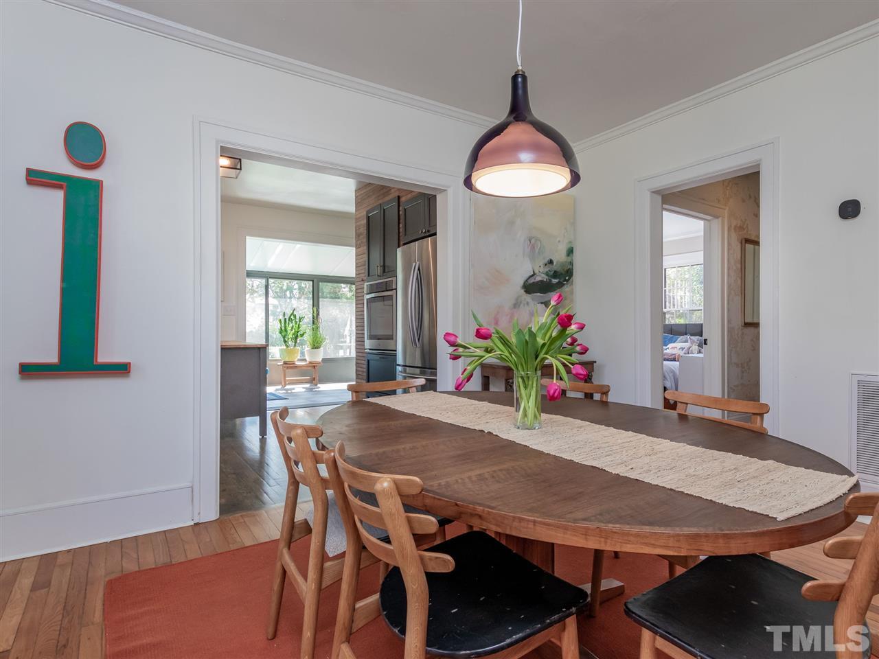 1902 Alexander Road Raleigh, NC 27608 - Photo 11 of 30 a view of a dining room with furniture and wooden floor