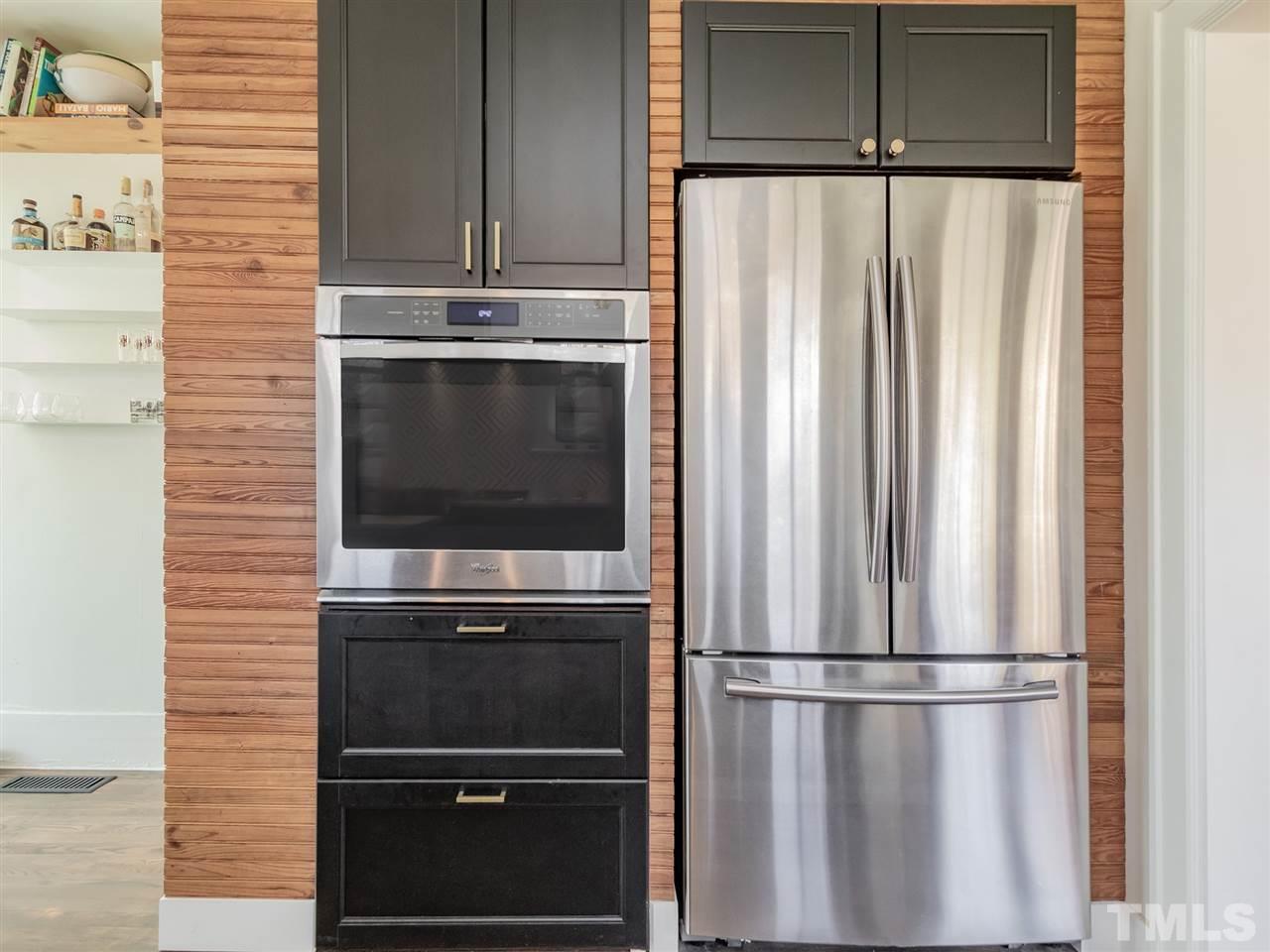 1902 Alexander Road Raleigh, NC 27608 - Photo 14 of 30 a view of a kitchen with a refrigerator cabinets and a ceiling fan