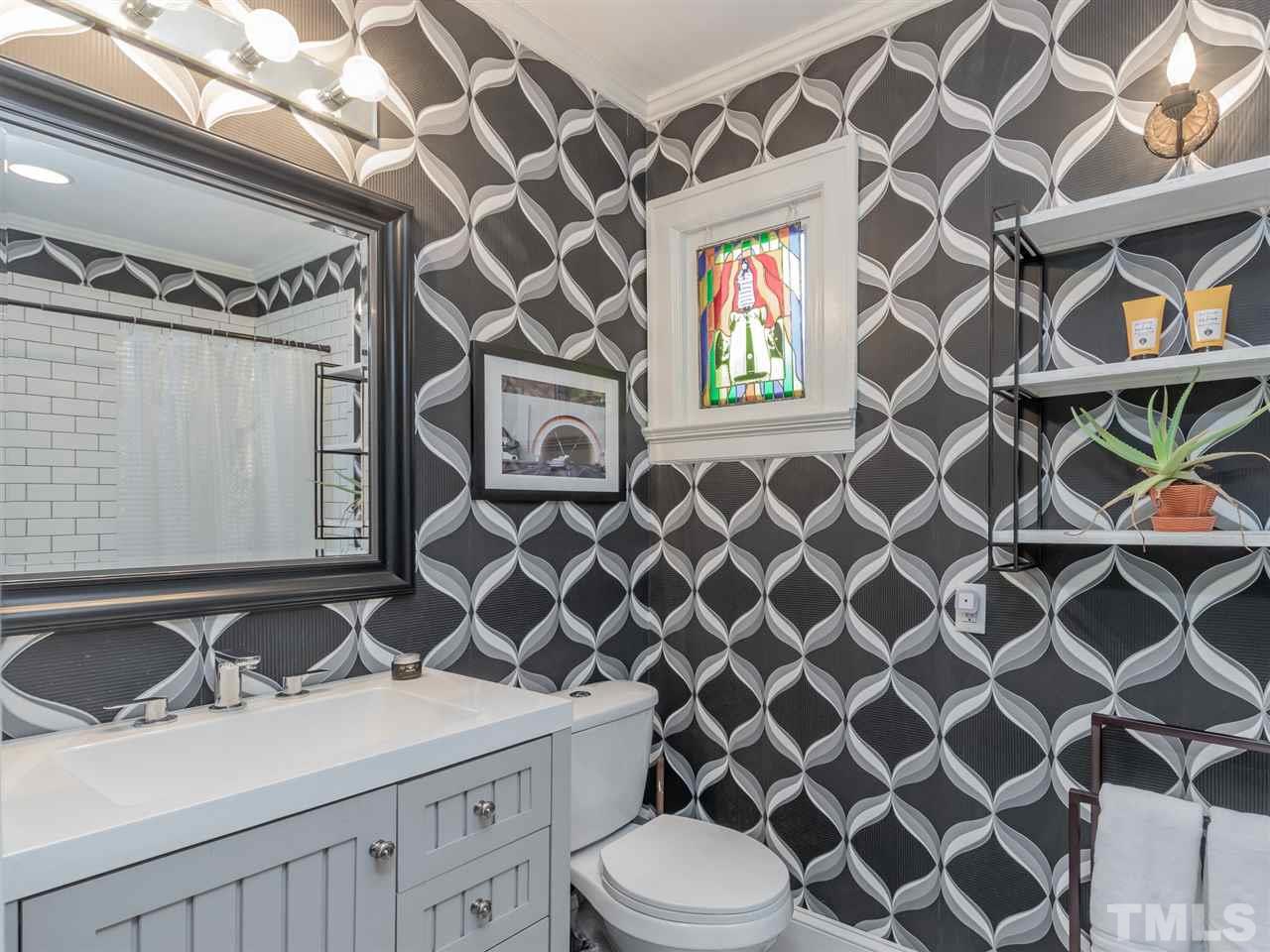 1902 Alexander Road Raleigh, NC 27608 - Photo 18 of 30 a bathroom with a sink toilet and shower