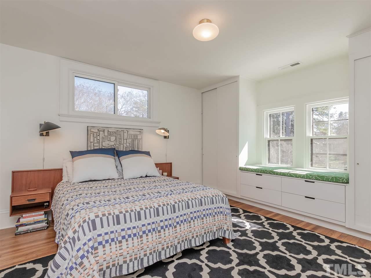 1902 Alexander Road Raleigh, NC 27608 - Photo 21 of 30 a bedroom with a large bed and a window