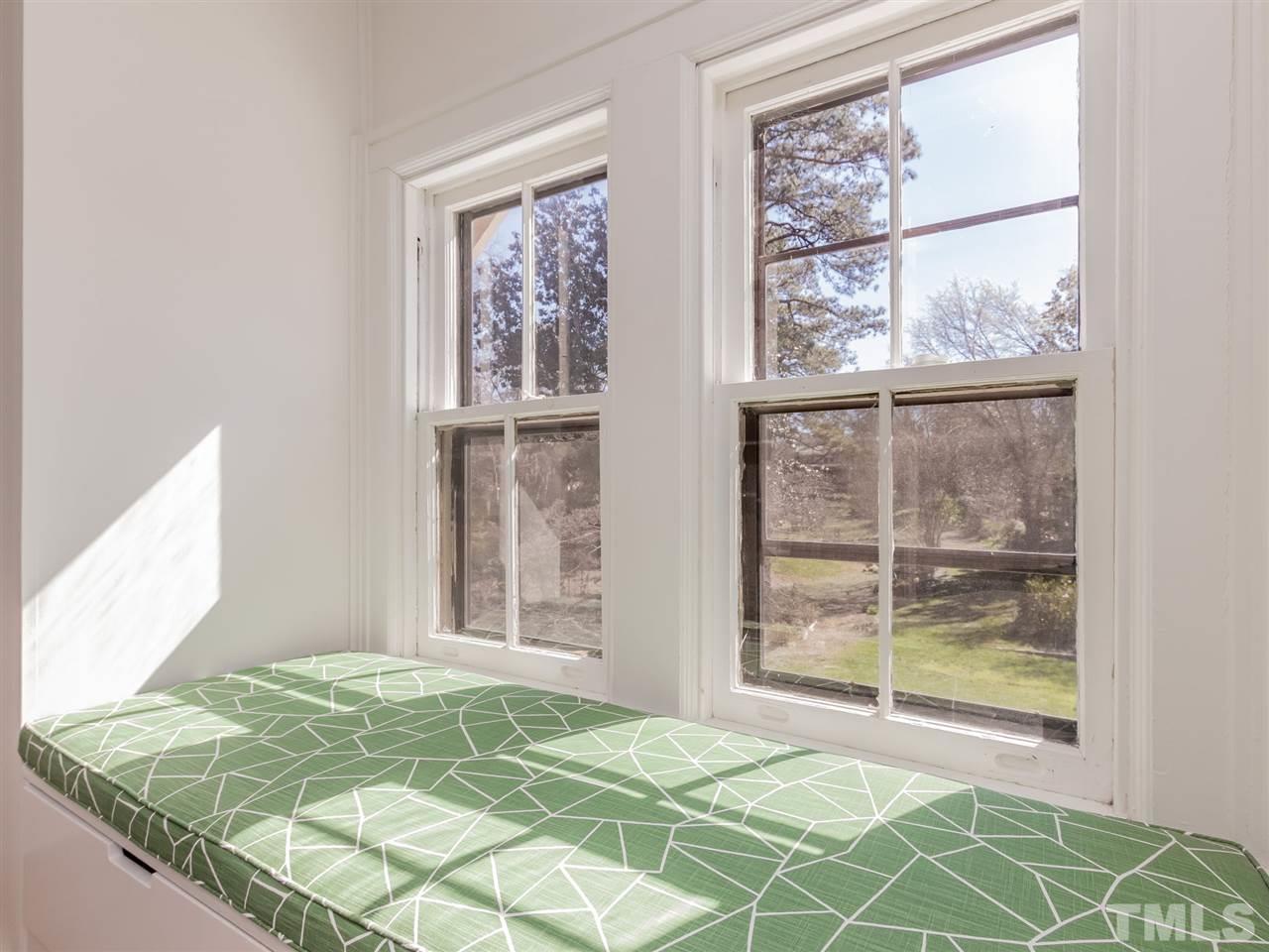 1902 Alexander Road Raleigh, NC 27608 - Photo 22 of 30 a bedroom with a bed and a window