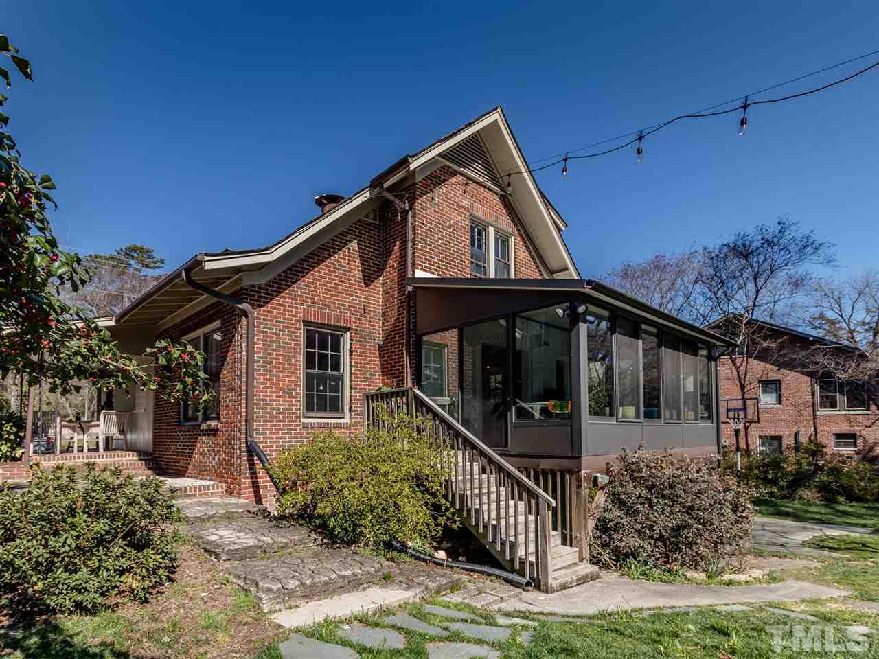 1902 Alexander Road Raleigh, NC 27608 - Photo 25 of 30 a front view of a house with yard and green space