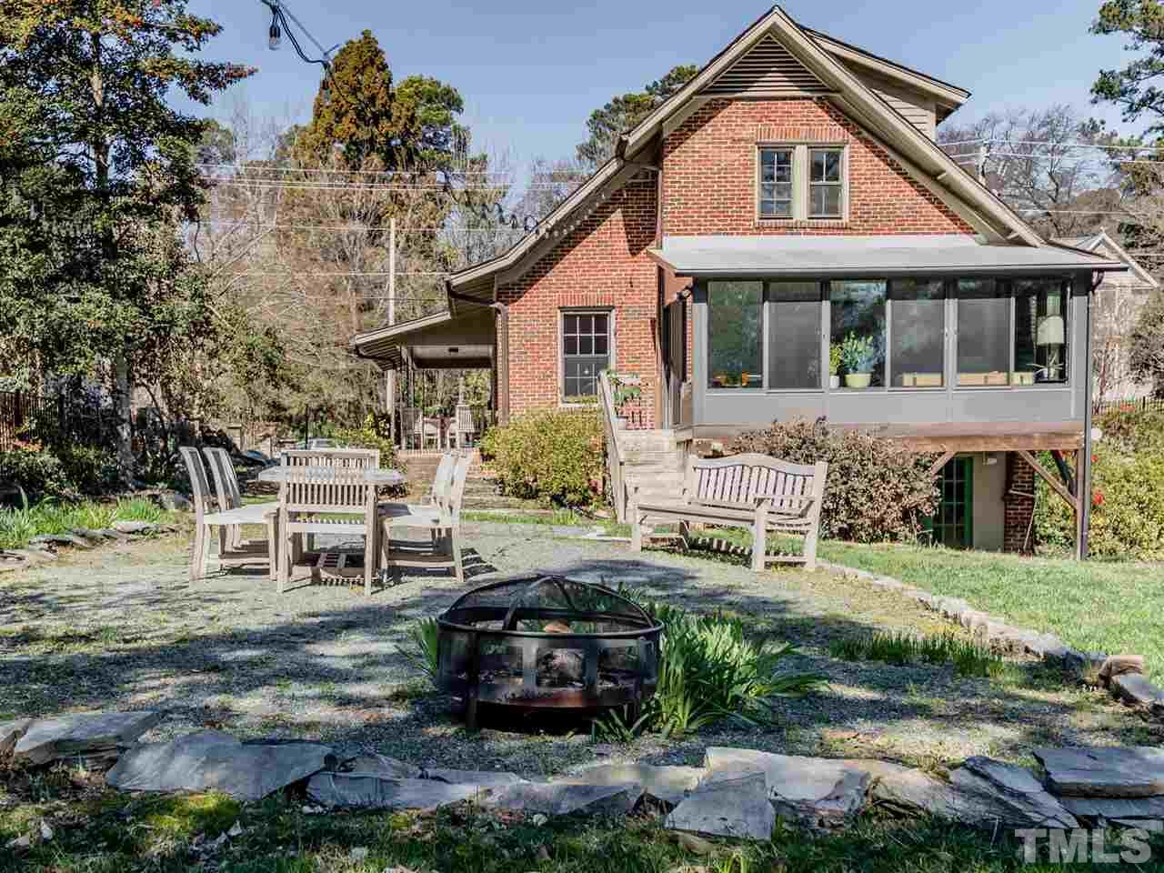 1902 Alexander Road Raleigh, NC 27608 - Photo 26 of 30 a front view of a house with a garden