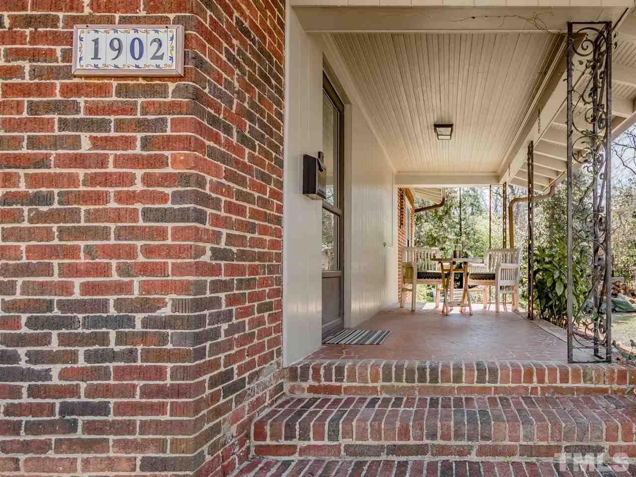 1902 Alexander Road Raleigh, NC 27608 - Photo 4 of 30 a view of a brick wall with many windows