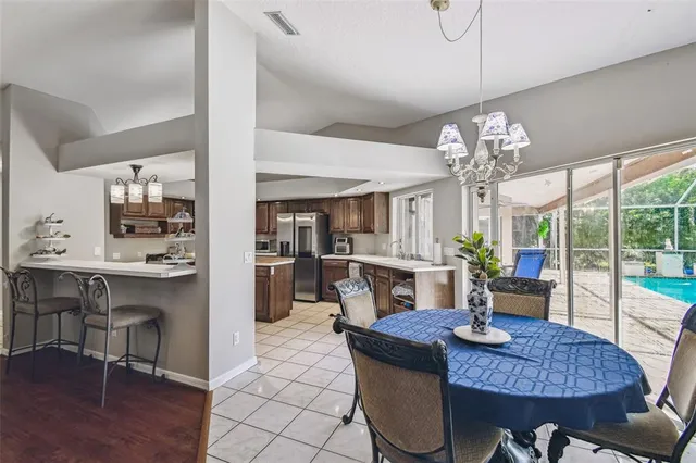 a view of backyard of house and car parked