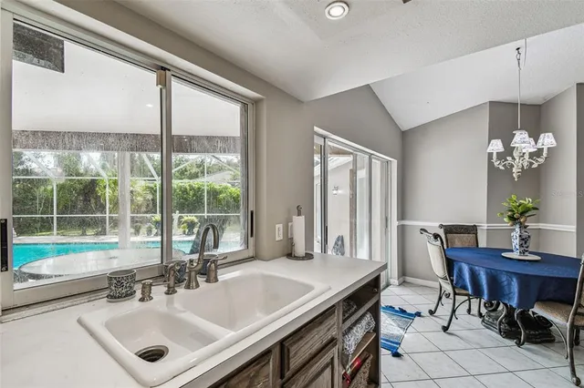 an aerial view of residential houses with outdoor space and street view