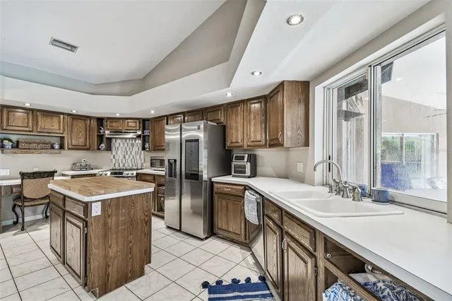 an aerial view of residential houses with outdoor space and street view