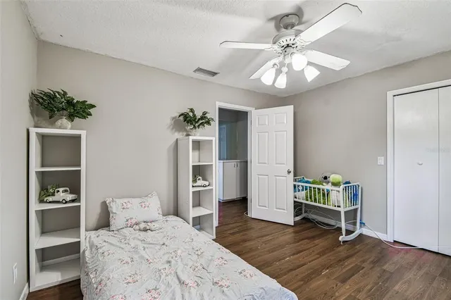 an aerial view of residential houses with outdoor space and street view