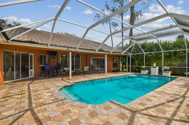 a view of a livingroom with furniture window and wooden floor