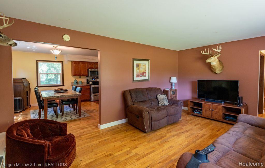 10150 Andersonville Road Clarkston, MI 48346 - Photo 7 of 18 Living room~View of dining room