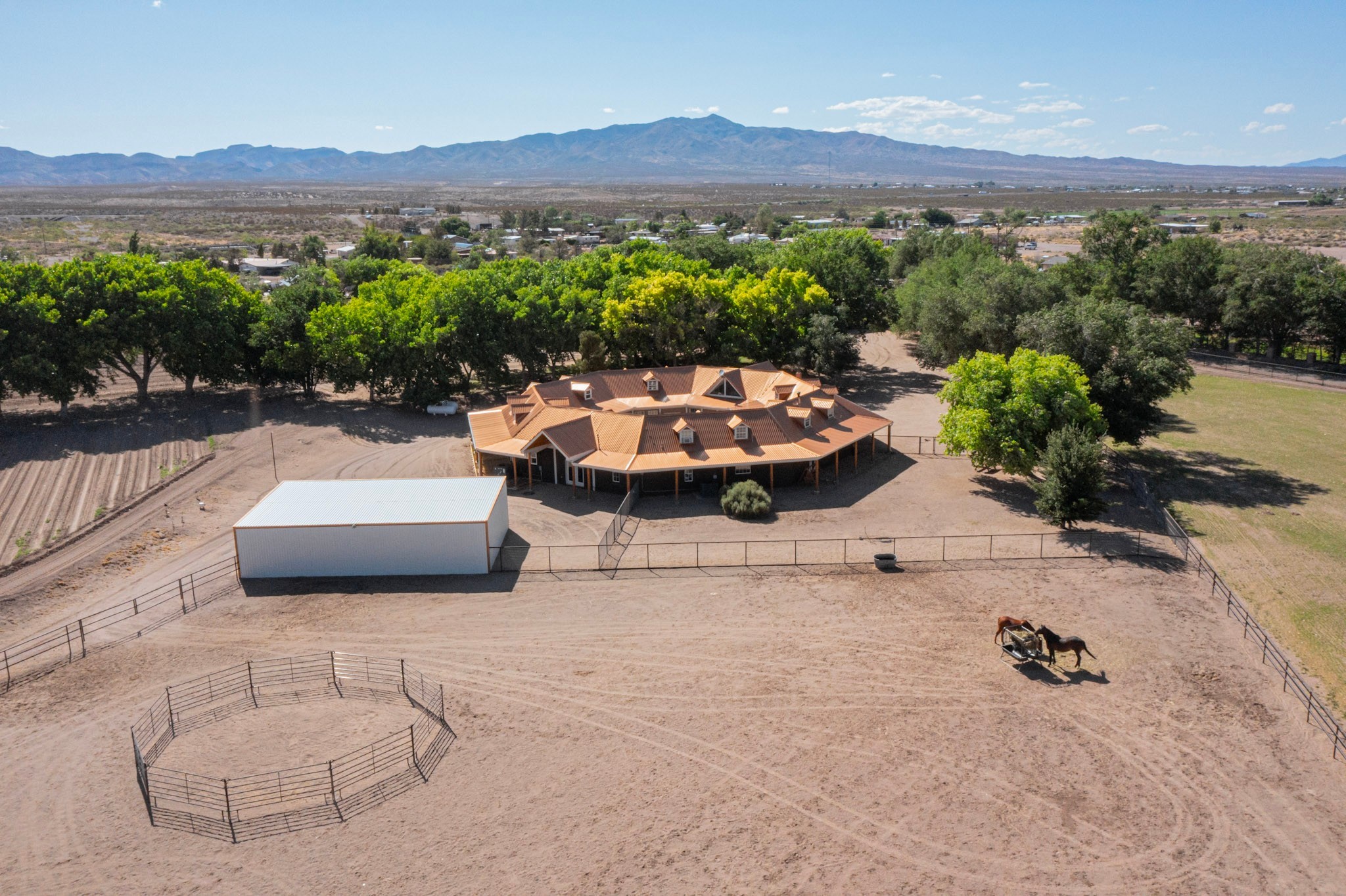 26 Schmittle Road Socorro, NM 87801 - Photo 8 of 80 Different angle aerial view of the home with the horse dry lot, and carport behind the house