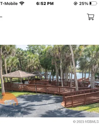 a view of a swimming pool with trees