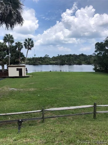a view of a lake with a garden