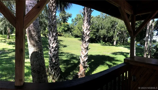 a view of a yard from a balcony