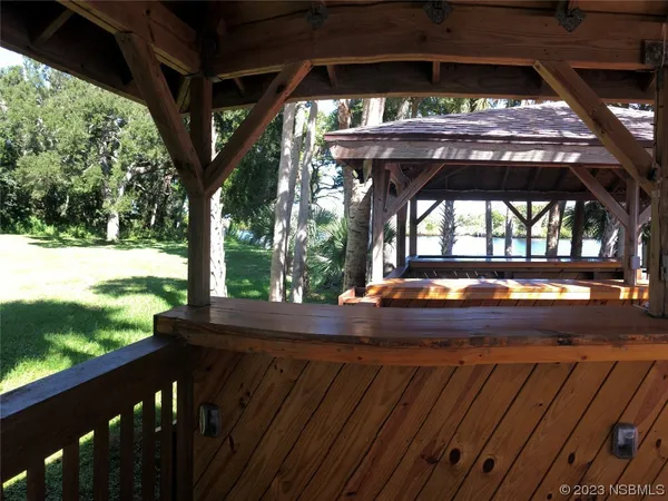 a view of backyard with deck and outdoor space