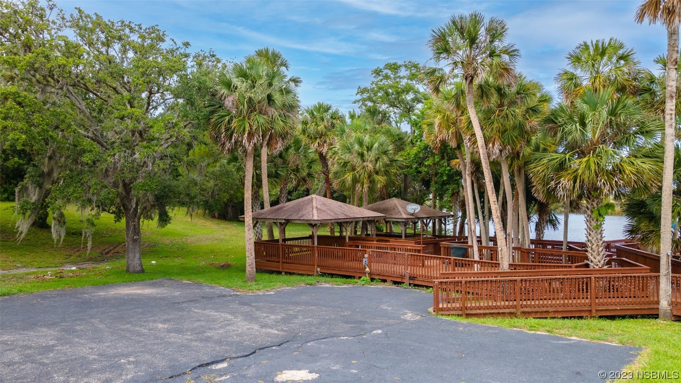 1003-1005 Highway 1 Ormond Beach, FL 32174 - Photo 32 of 52 a view of a park with large trees