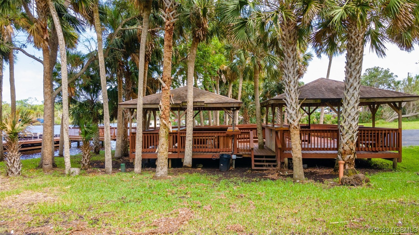 1003-1005 Highway 1 Ormond Beach, FL 32174 - Photo 40 of 52 front view of a house with a yard table and chairs