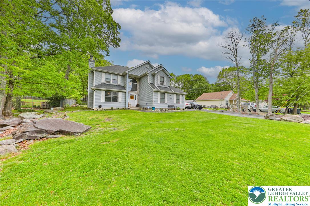 4608 Pine Ridge Drive West Bushkill, PA 18324 - Photo 4 of 62 A graceful home with ample yard space and mature trees awaits your personal touch.