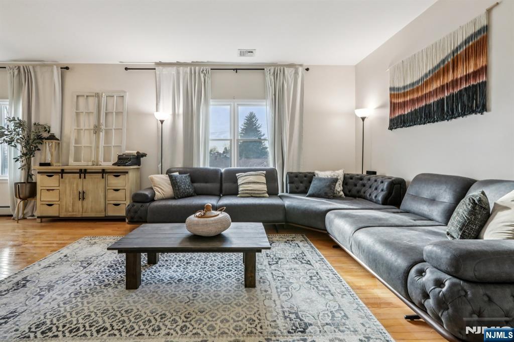 28 George Street Saddle Brook, NJ 07663 - Photo 30 of 50 a living room with furniture and a rug