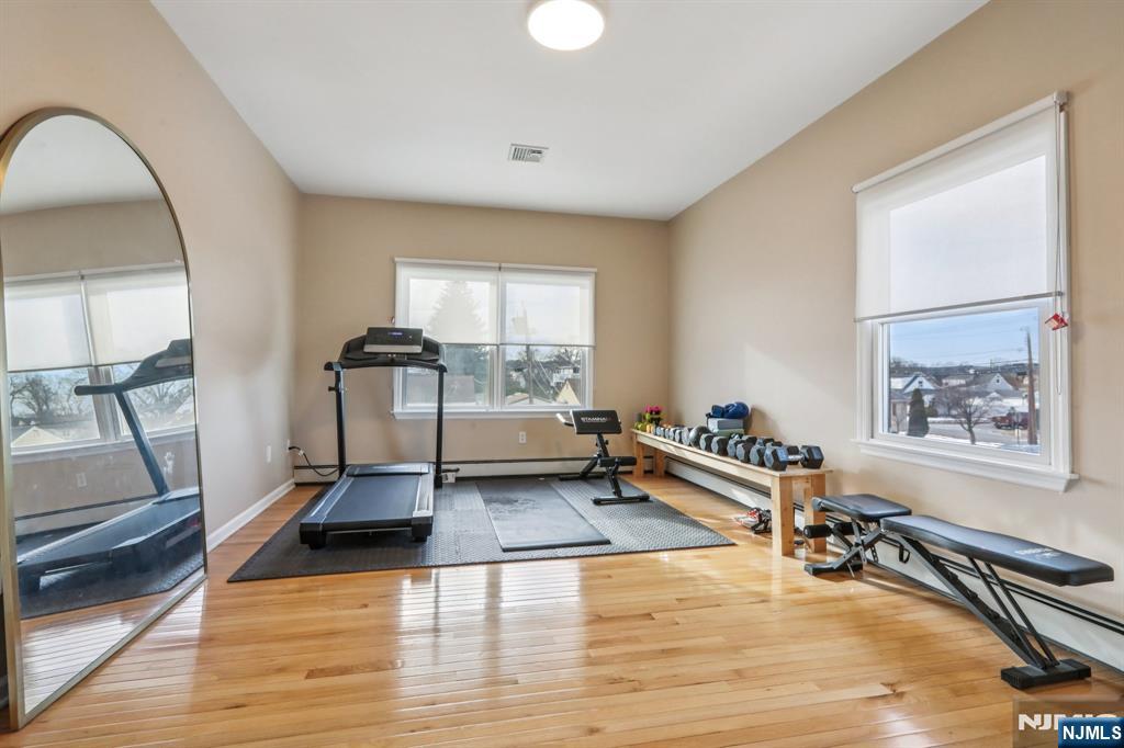 28 George Street Saddle Brook, NJ 07663 - Photo 31 of 50 a living room with furniture and a wooden floor