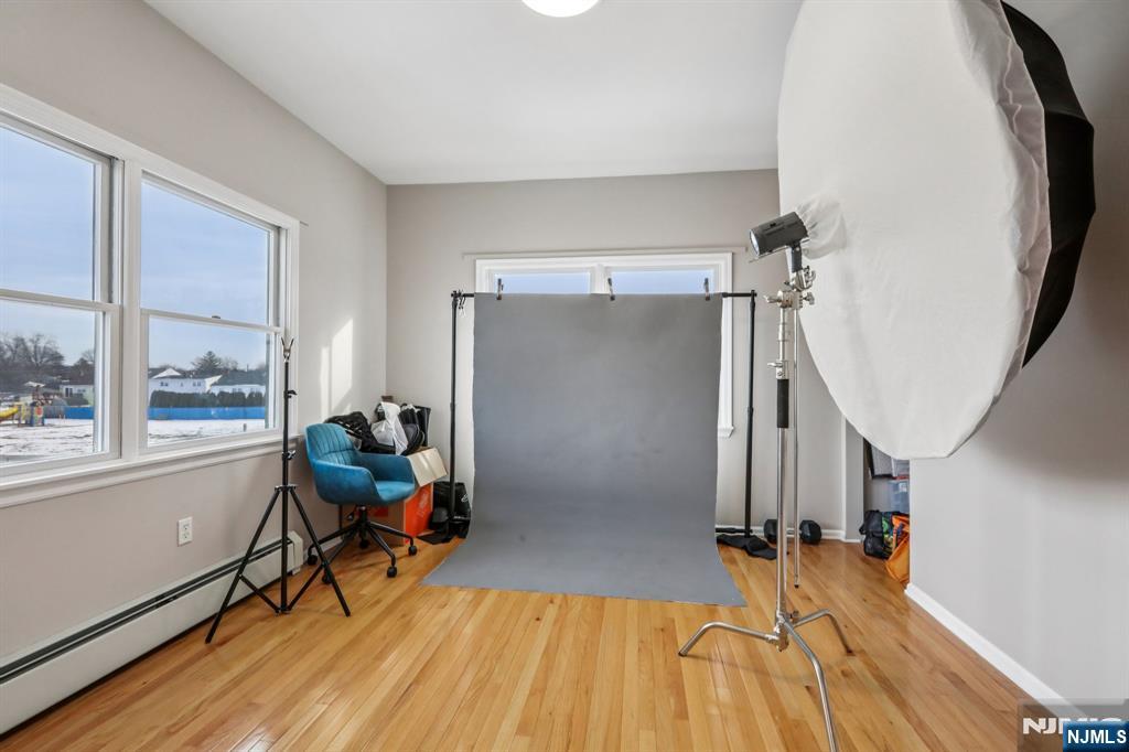 28 George Street Saddle Brook, NJ 07663 - Photo 37 of 50 a view of empty room with wooden floor and fan