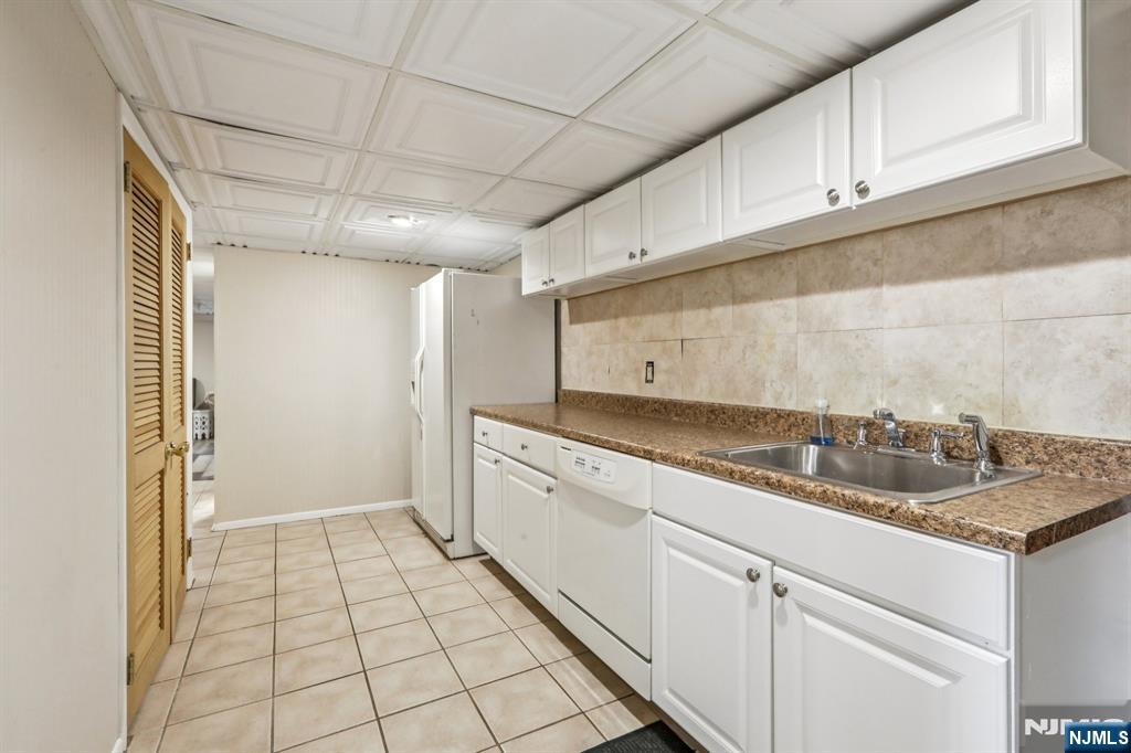 28 George Street Saddle Brook, NJ 07663 - Photo 40 of 50 a kitchen with a sink and cabinets
