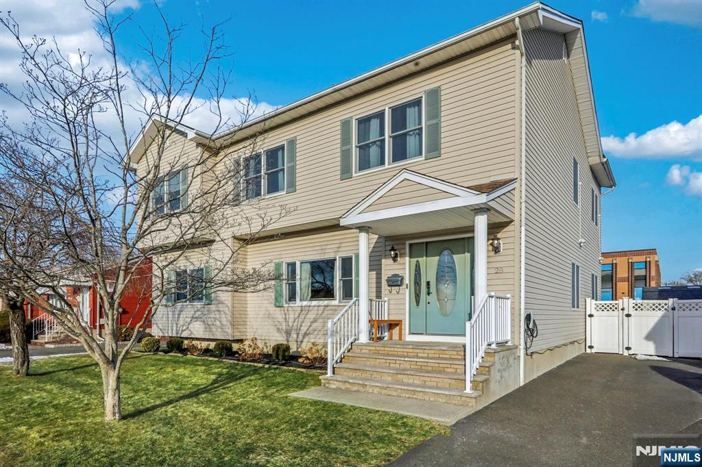 28 George Street Saddle Brook, NJ 07663 - Photo 4 of 50 a front view of a house with a yard