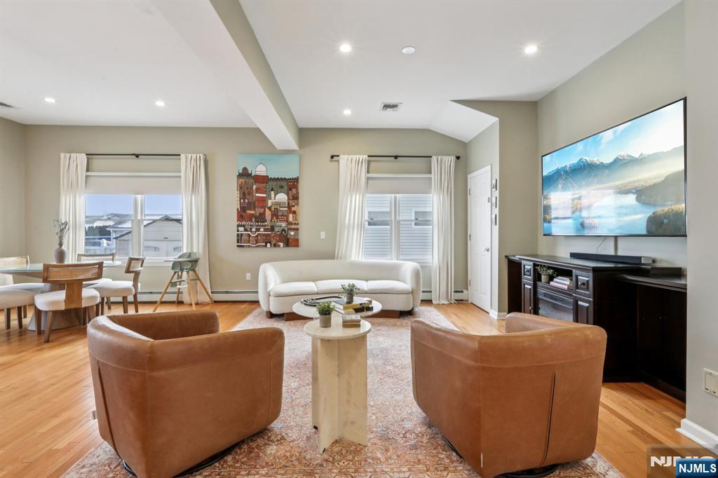 28 George Street Saddle Brook, NJ 07663 - Photo 7 of 50 a living room with fireplace furniture and floor to ceiling windows