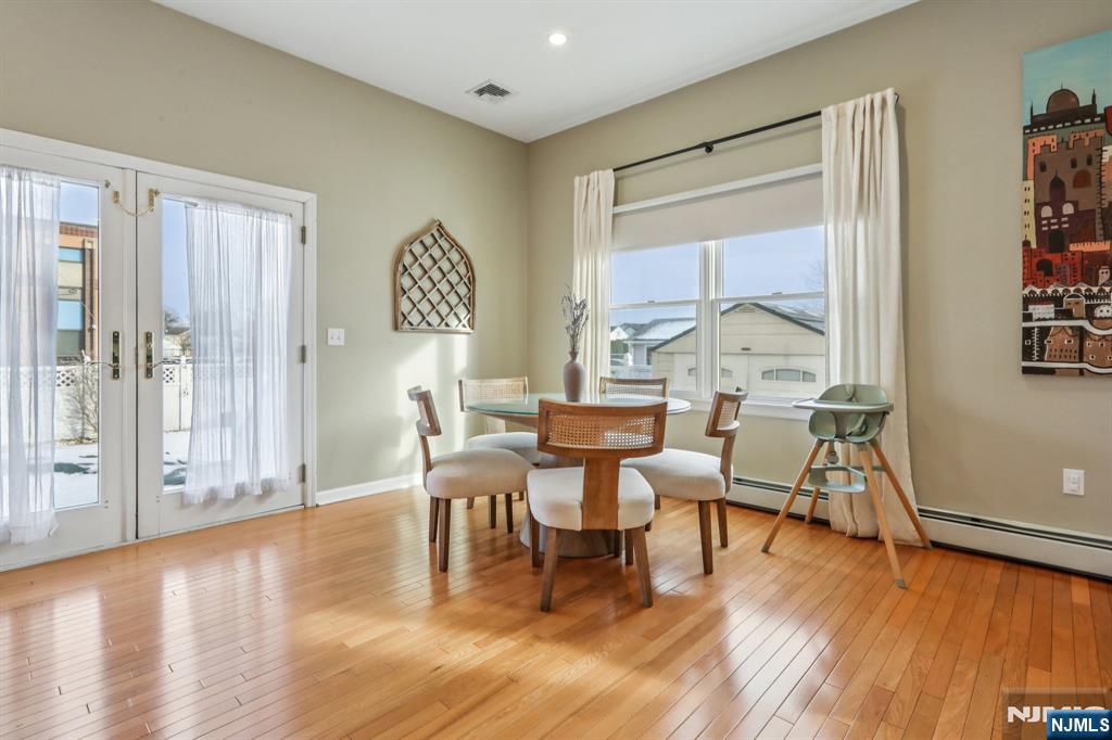 28 George Street Saddle Brook, NJ 07663 - Photo 10 of 50 a view of a dining room with furniture window and wooden floor