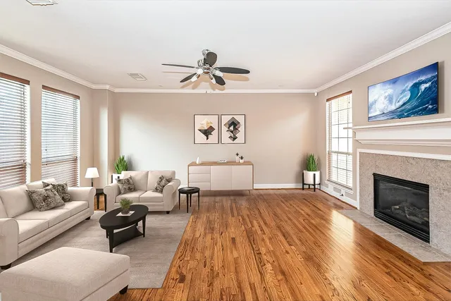 a bed room with a bed couches and a fireplace