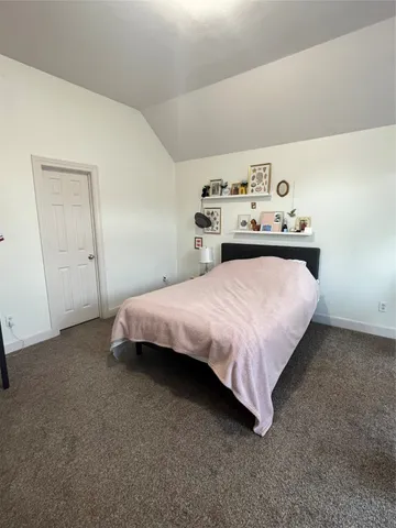 a bedroom with a bed and closet