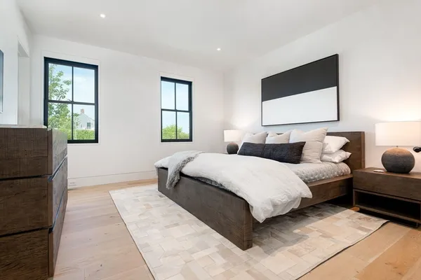 a bedroom with bed and window