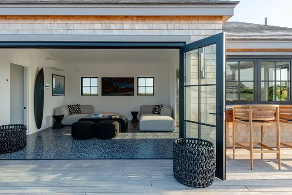 a living room with furniture a rug and a window