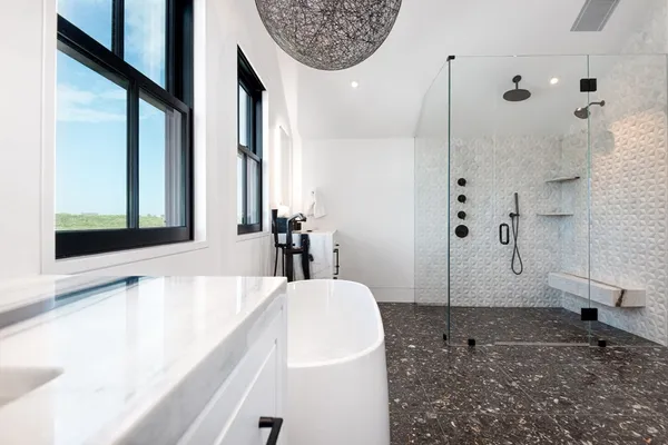 a bathroom with a bathtub and a shower