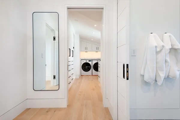 a spacious bedroom with a bed and glass window