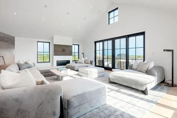 a bedroom with two beds and a large window