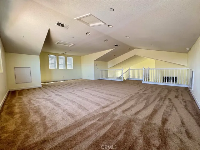 a view of empty room with window and fireplace