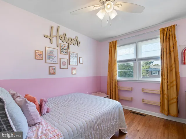a bathroom with a sink a toilet and shower curtain