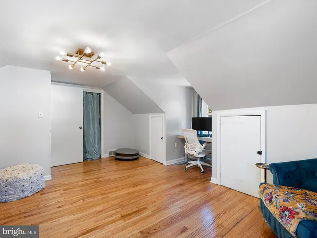 a green field with lots of trees in it