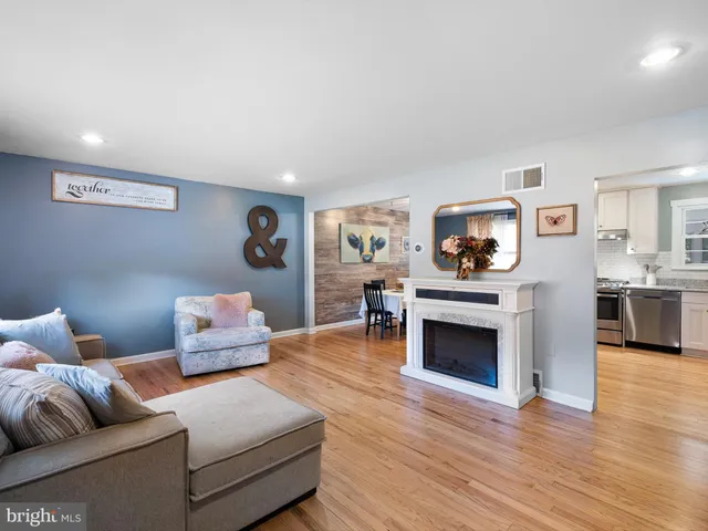 a bedroom with furniture and a fireplace